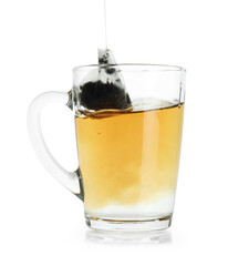 Brewing aromatic tea. Cup with teabag isolated on white