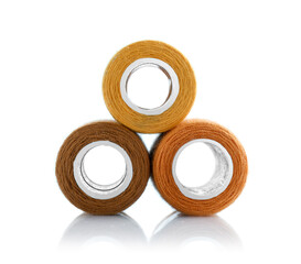 Spools of bright sewing threads isolated on white