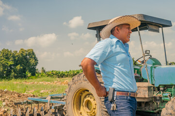 An agro industry worker finds himself in the middle of the field and the day's work has caused him...