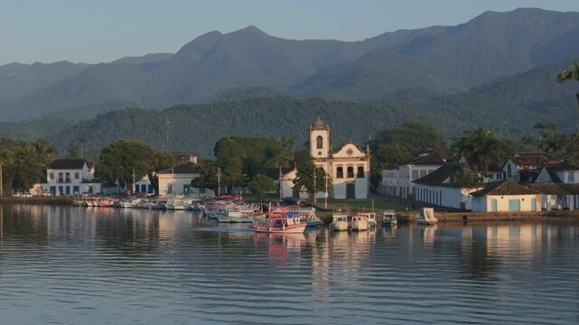 Paraty, a charming historic city, enchants with its preserved stone streets and a marina full of traditional boats, which reflect the rich local maritime culture.