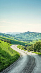 Fototapeta premium Winding road through vibrant green hills under a bright blue sky on a summer day