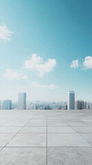 Empty concrete platform overlooking a cityscape with a bright blue sky and white clouds