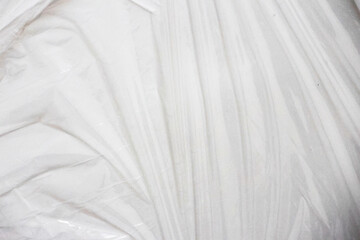 Obraz premium Plastic wrap texture for overlay. wrinkled stretched plastic effect. transparent plastic wrap on white background.