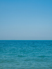 Obraz premium Photography landscape beautiful summer season vertical look view horizon tropical shore open sea cloud clean blue sky background calm nature ocean wave water nobody travel at Thailand sun day time.