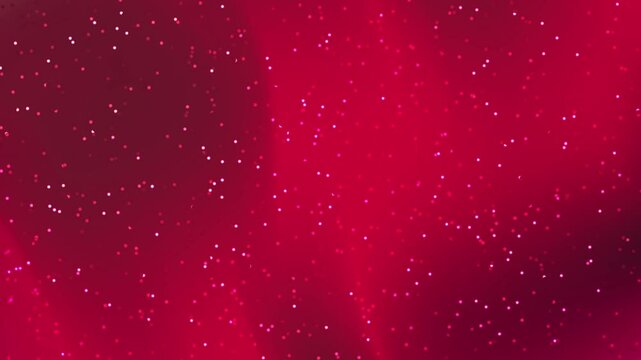 Red background with white and pink dots suitable for vibrant and fun designs, perfect for greeting cards or party invitations
