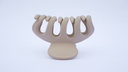 Matte beige plasctic hair claw clip isolated on white background