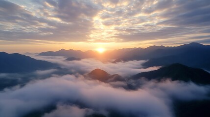 Stunning sunrise over misty mountain landscape creating a dramatic sky : Generative AI