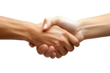 A close-up of two hands shaking, symbolizing agreement, negotiation, partnership, and mutual respect in a professional environment.