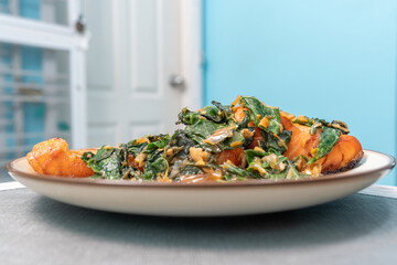 Fried fresh salmon topped with Pad Krapow. Salmon stir-fried with holy basil. Thai fusion food also...