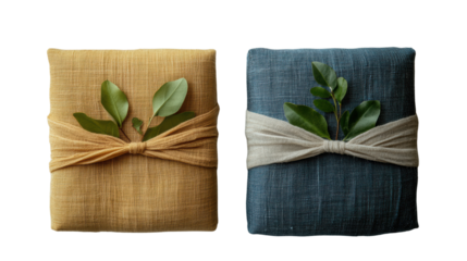 Two beautifully wrapped gift parcels with natural greenery. Perfect for eco-friendly packaging ideas or celebration themes.