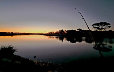 fishing at sunset