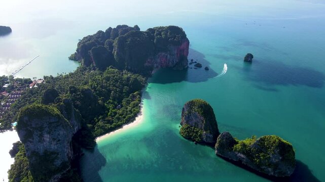 Experience the stunning beauty of Krabi as vibrant emerald waters meet dramatic cliffs, surrounded by lush greenery. Perfect for adventure and relaxation, this paradise awaits
