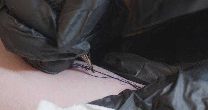 Closeup of Tattoo Being Drawn and Wiped