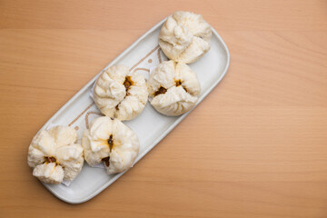 Soft and fluffy pork buns on plate