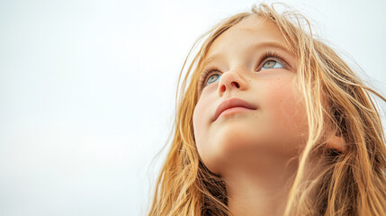 Naklejka premium A young girl with long blonde hair is looking up, generative AI