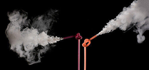 Plastic bio degradable straws with mist shooting from straws creating unique patterns