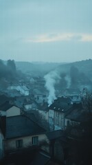 Foggy Morning Over Sleepy Town with Chimney Smoke Rising