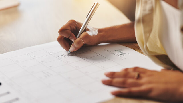 Calendar, writing and hands of person in office for schedule, planning and reminder on paper. Professional, administration and worker with monthly planner for appointment, business notes and deadline