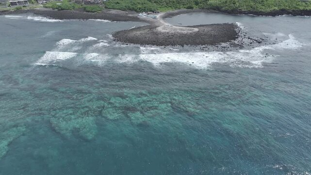 Comoros, Grande Comore, Foumbouni, ilot la Tcheka, small fishing harbor slow forward from ocean