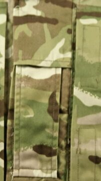 Close-up of soldier holding dairy on white background
