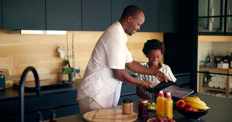 Backpack, lunch and dad with child in kitchen getting ready for morning routine, start day and back...