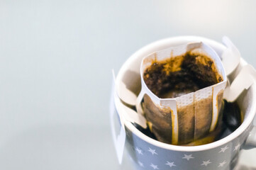 mug with dripping coffee bag