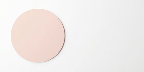 A Pale Pink Circular Element on a White Background, Ideal for Minimalist Designs and Presentations