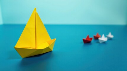 A Single Yellow Origami Sailboat Leads a Fleet of Smaller Paper Boats Across a Vibrant Blue Surface
