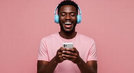 A happy African American man listening to music on his smartphone