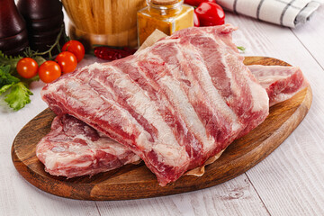 Raw pork ribs over board