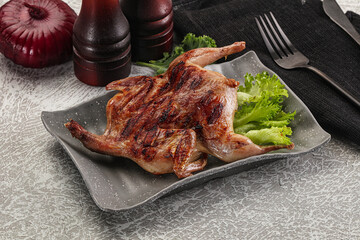 Grilled quail in the plate