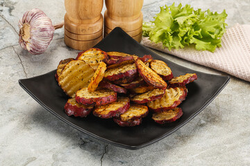 Baked red batat slices with herbs