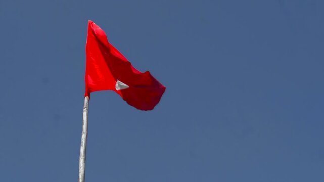 Hindu flag on a blue sky, Red flag