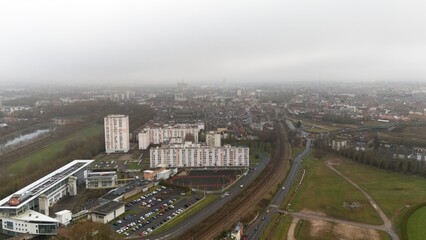 Fototapeta premium View of Amiens, France with Residential Buildings, Railway, and Green Spaces