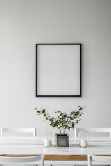 Modern dining area featuring a blank wall art frame, minimalist decor, fresh greenery in a vase, and simple table setup. Ideal for interior design mockups.