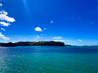 View of the blue tropic ocean from a ferry on the Island of Waiheke in Auckland, New Zealand.