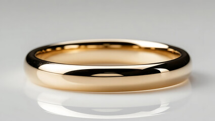 wedding rings on a white background with a shiny, golden  