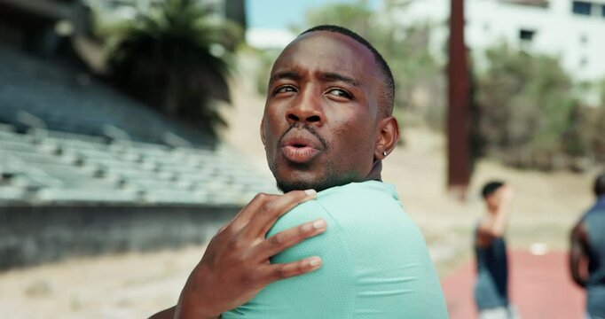 Man, fitness and stretching with arms at stadium for workout preparation, race or marathon on track. Male person, athlete or runner getting ready with warm up for training, exercise or sprint in city