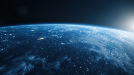 Fototapeta premium A stunning view of Earth from space, showcasing the planet's blue oceans and illuminated landmasses against the dark backdrop of the cosmos.
