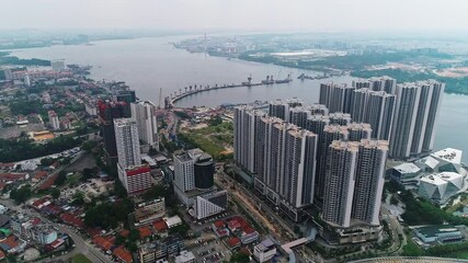 Aerial Birds Eye view flying over MRT Line Rapid Transit System from Johor Bahru