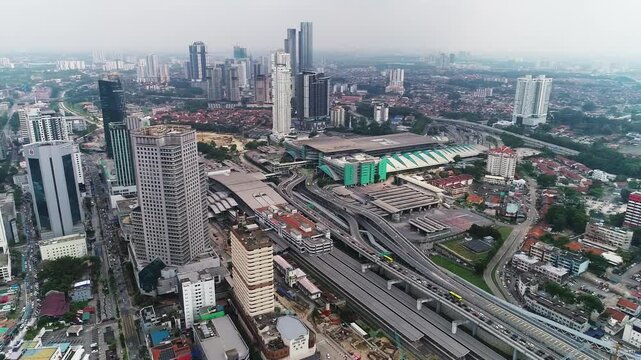 Aerial Birds Eye view flying over Johor Bahru, panning shot