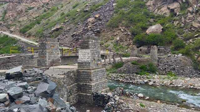 Shot of land side area with a pontoon bridge in front in Skardu, Pakistan. JSR Road.