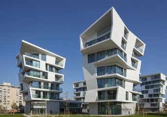Modern apartment buildings, minimalist architecture, white facade, large windows, geometric shapes, urban living, contemporary design, clean lines