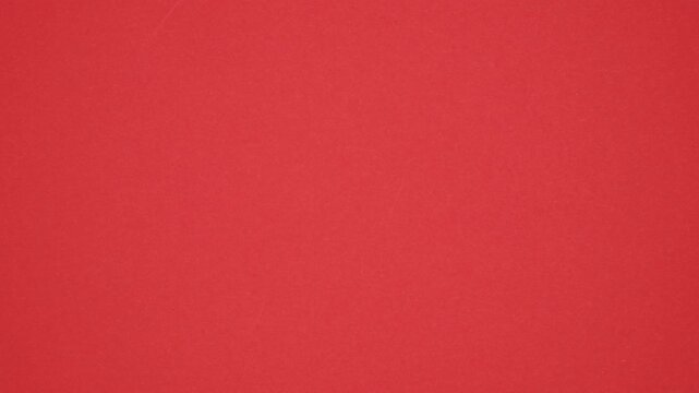 Red Paper sheet tearing from the center opening white background, screen transition. Stop motion animation.