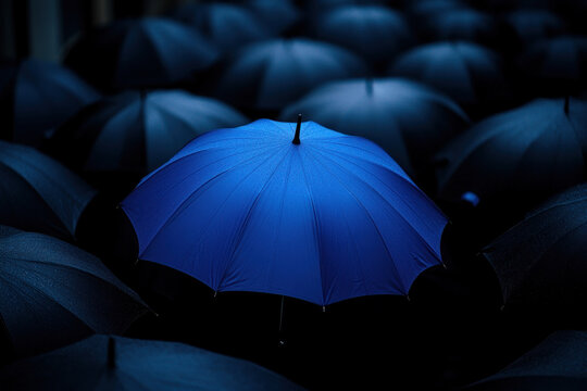 Vibrant group of colorful umbrellas lined up on a sunny beach, casting cheerful shadows on the golden sand.