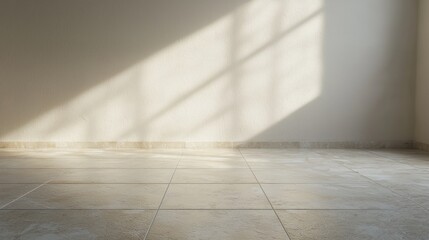 A sunlit room with a smooth floor and a light shadow cast on the wall, creating a serene and minimalist atmosphere.