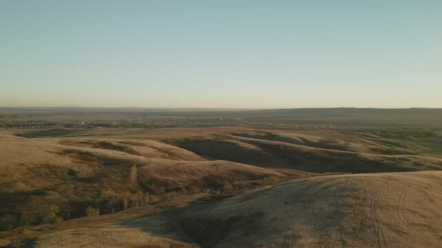 Autumnal hills and valleys at sunset