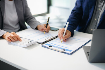 Business People Talking Discussing with financial document data charts and graphs Team business meeting