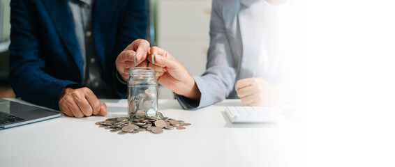 Hand putting mix coins and seed in clear bottle and business investment growth concept.