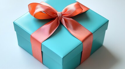 Obraz premium A vibrant turquoise gift box with a glossy finish, tied with a contrasting coral ribbon, on a white background,